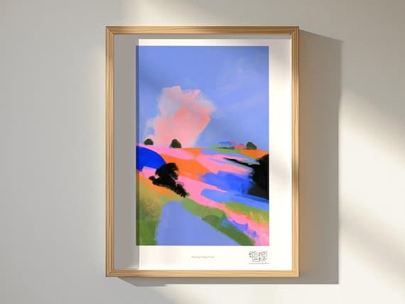Winding Village Road art print, framed, shown in a styled room